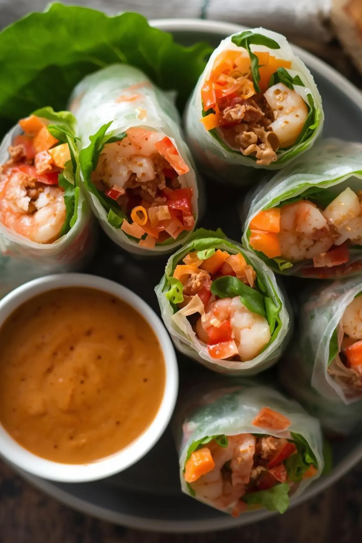 Fresh Vietnamese spring rolls filled with vegetables and shrimp served with peanut dipping sauce